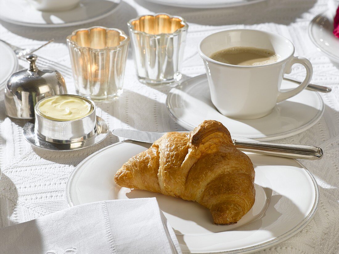 Breakfast setting with croissant
