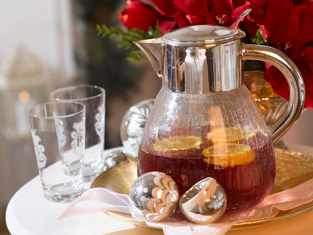 Punch with orange slices in glass jug (Christmas)