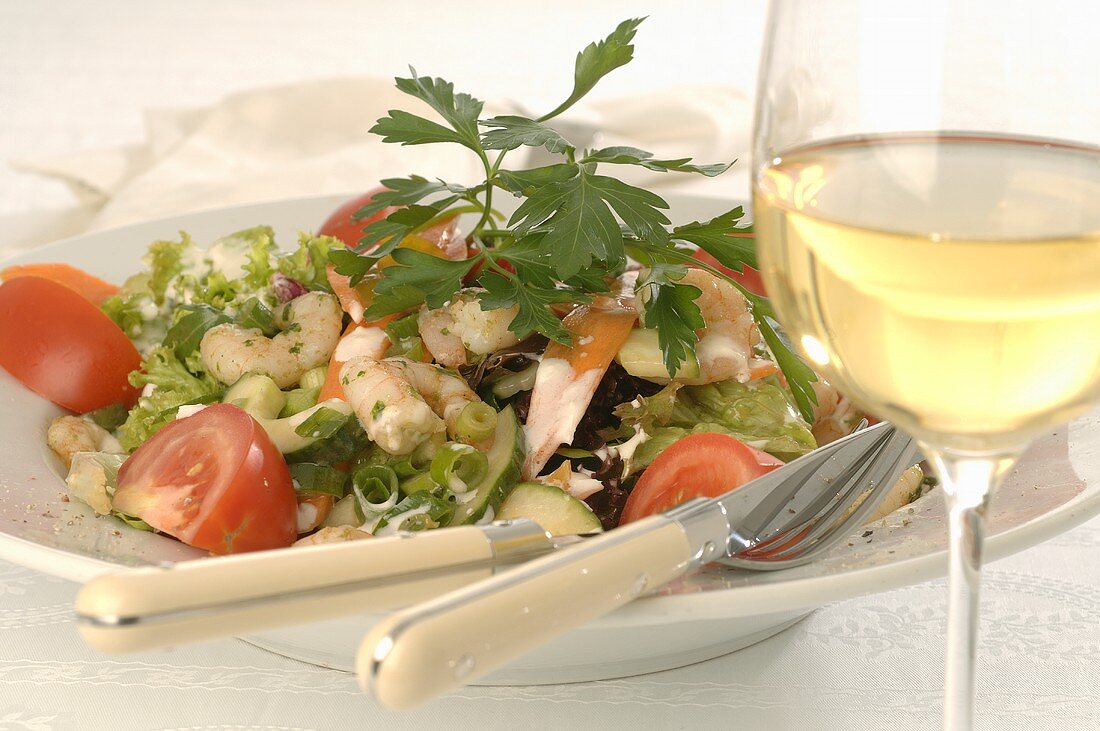 Seafood salad and glass of white wine