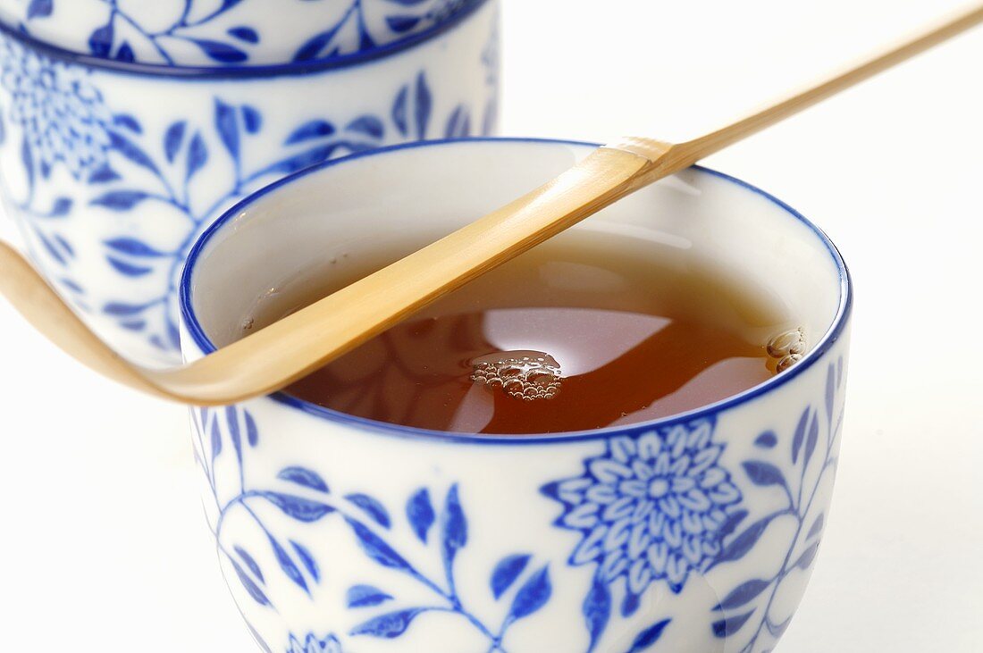 Bowl of tea with bamboo spoon