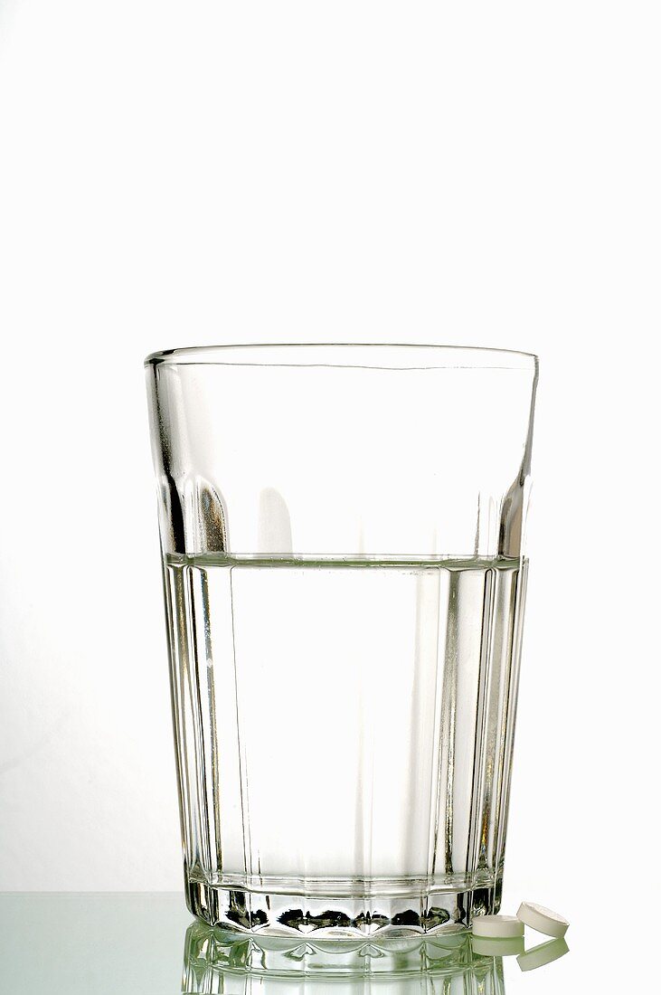 Schüssler Salts tablets with a glass of water