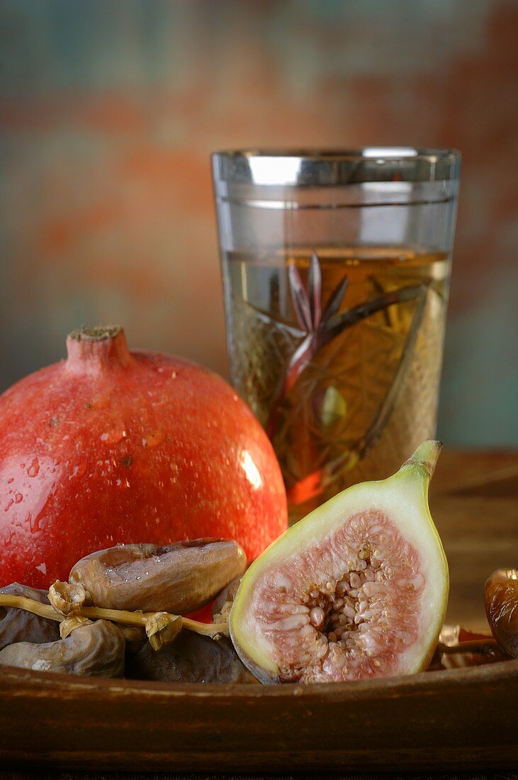 Pomegranate, fig and dates, glass of tea
