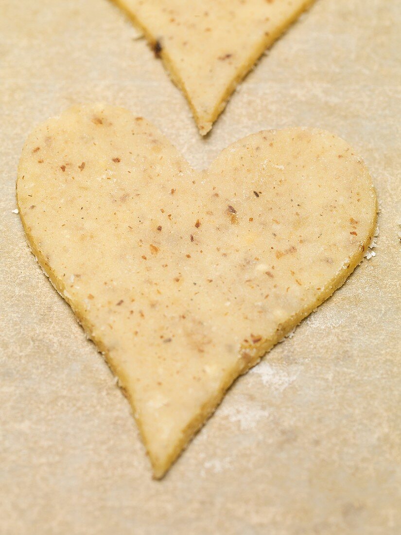 Pastry hearts on baking parchment