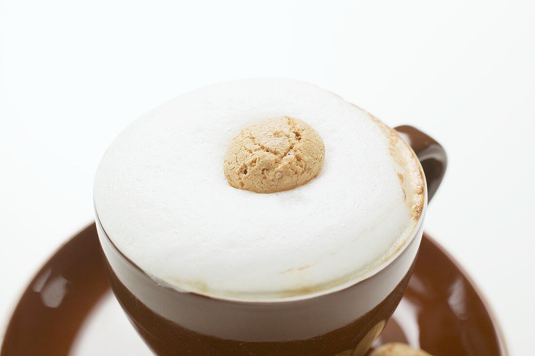 Cup of cappuccino and amaretti