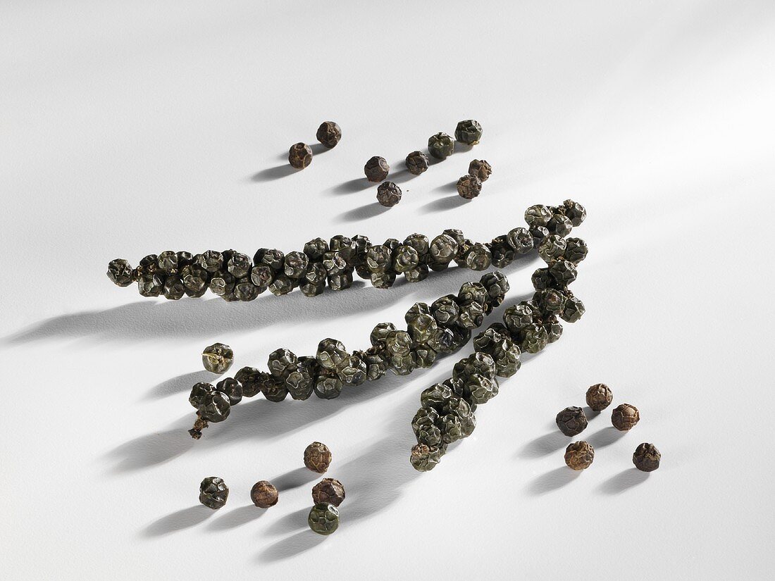 Bunches of black peppercorns