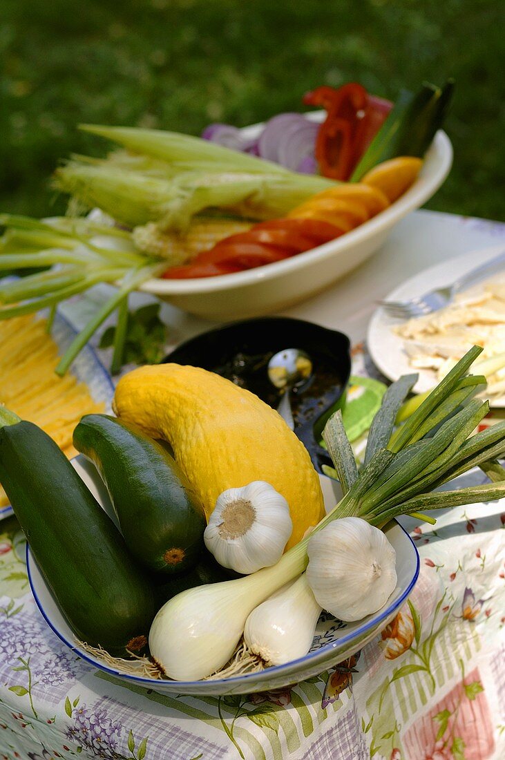 Dish of fresh vegetables on a garden table