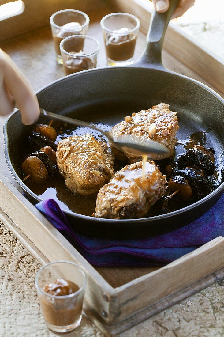 Frying pork fillet with sweet chestnuts in frying pan