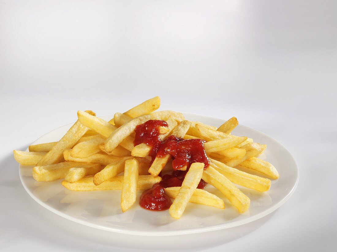 Chips with ketchup on plate