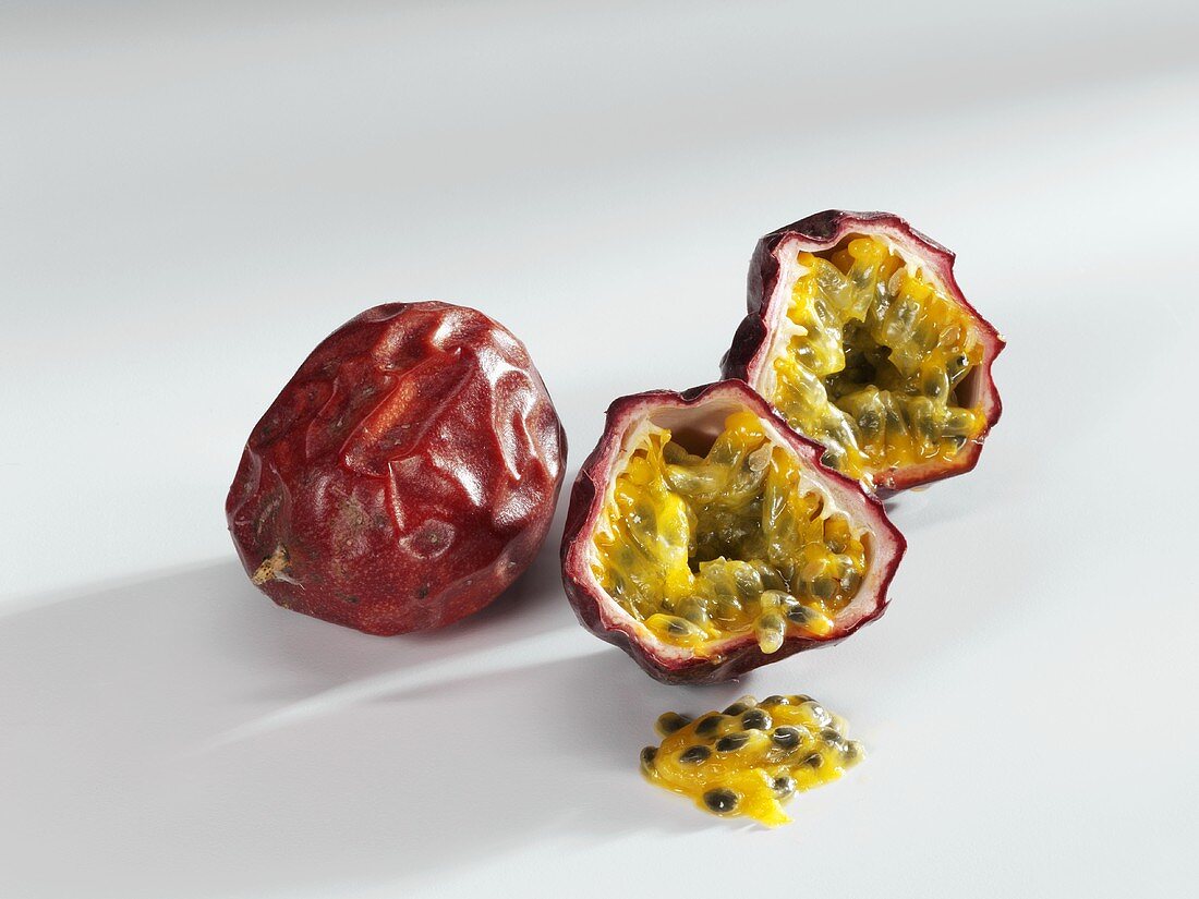 Passion fruit, whole and halved