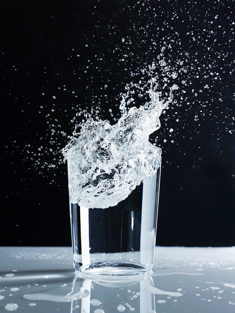 Water splashing out of a glass