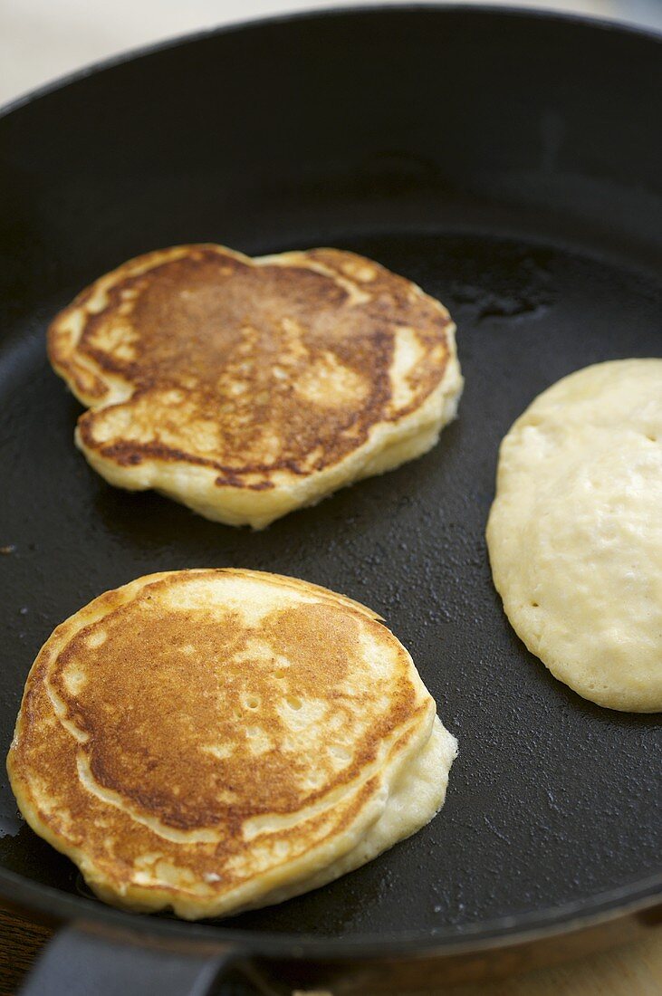 Ricotta pancakes in a frying pan