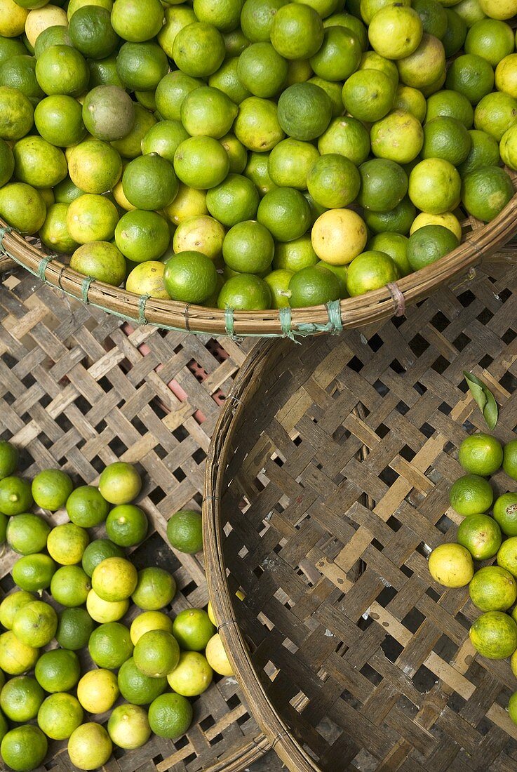 Limes in Thai market baskets