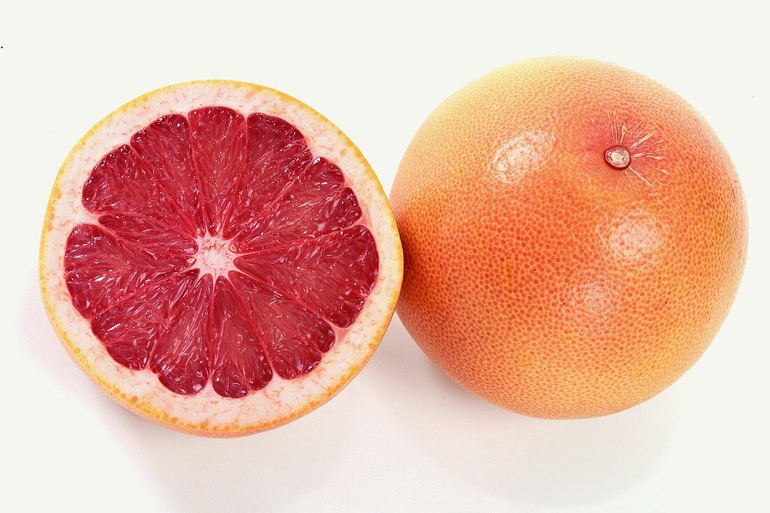 Grapefruit half and whole grapefruit
