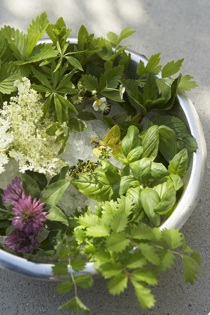 Fresh herbs and flowers in a dish