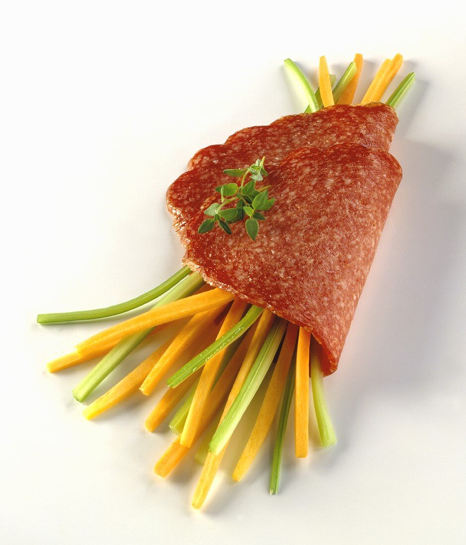 Slices of cervelat with leek and carrot sticks