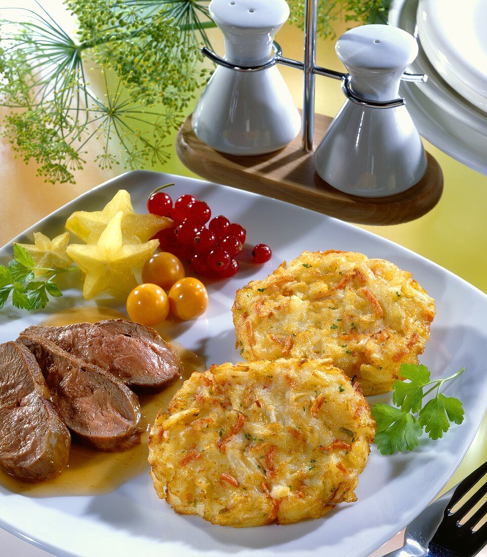 Fried duck breast with red wine sauce and ham rösti