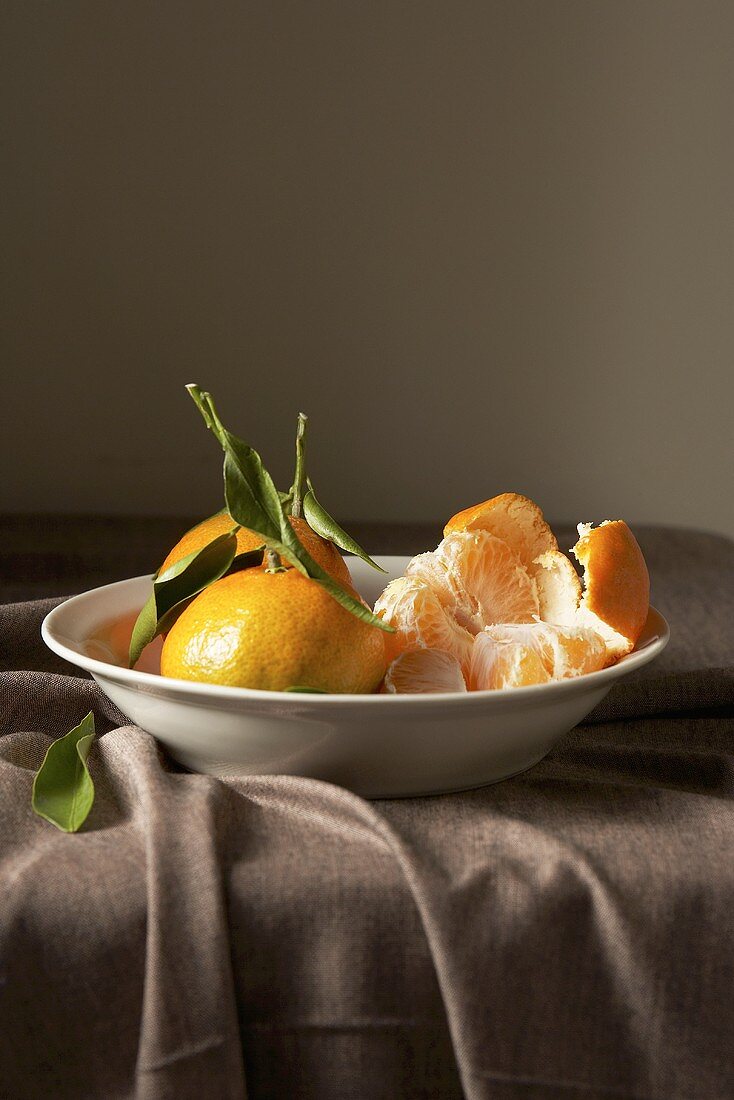 Mandarin oranges, one peeled