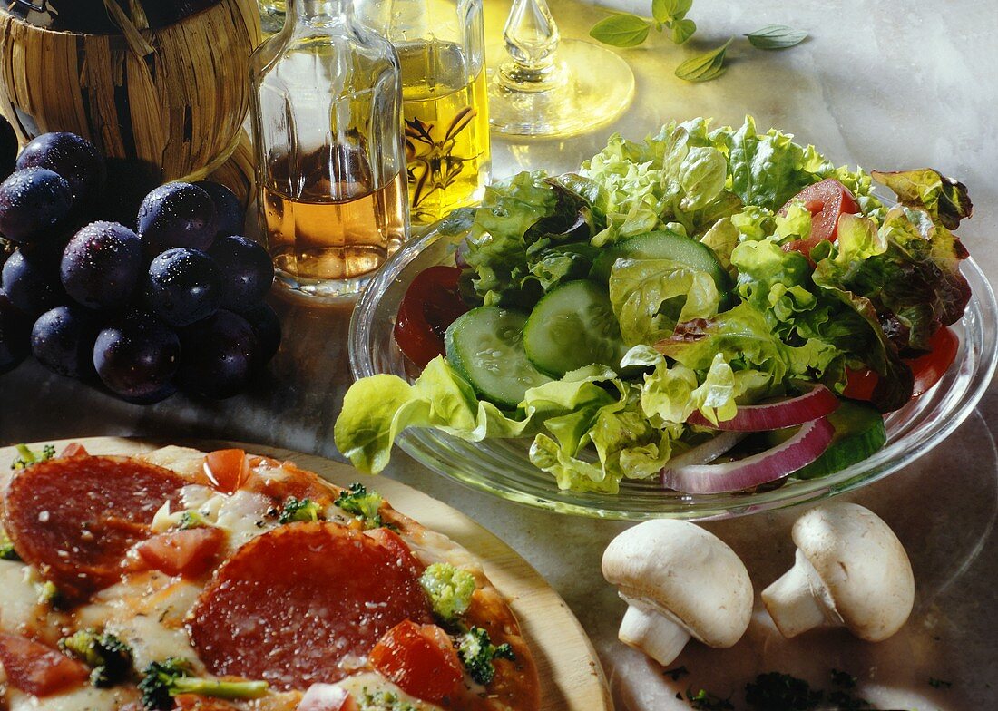 Salami pizza with mixed salad