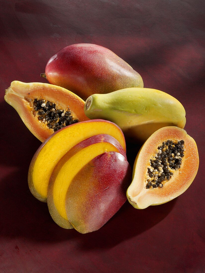 Exotic fruit: mango and papaya (whole, halved and sliced)