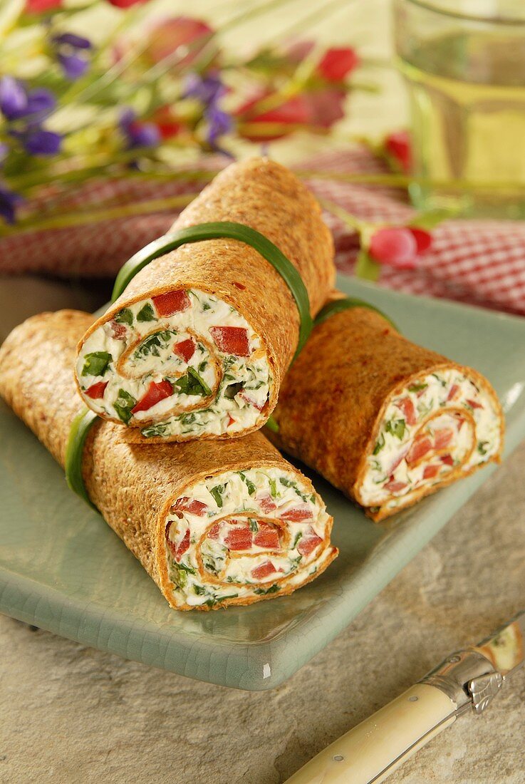 Tortilla wraps filled with soft cheese, peppers and spinach