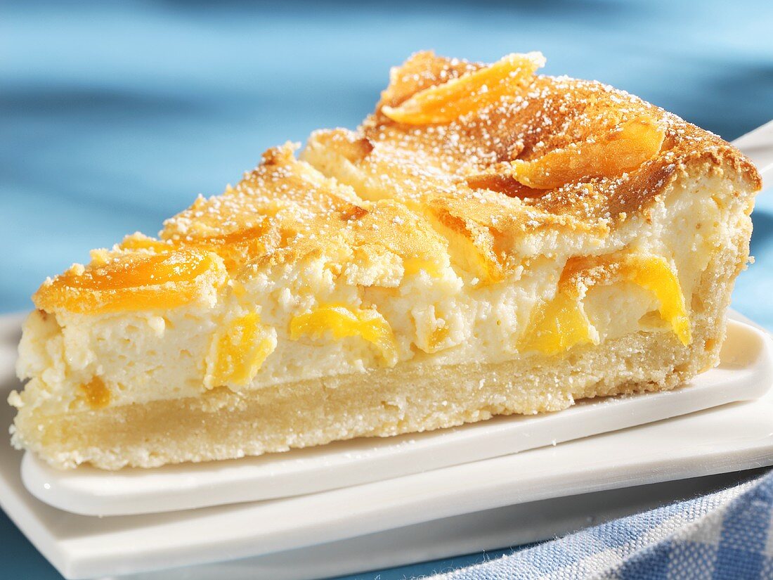 A piece of apricot cheesecake