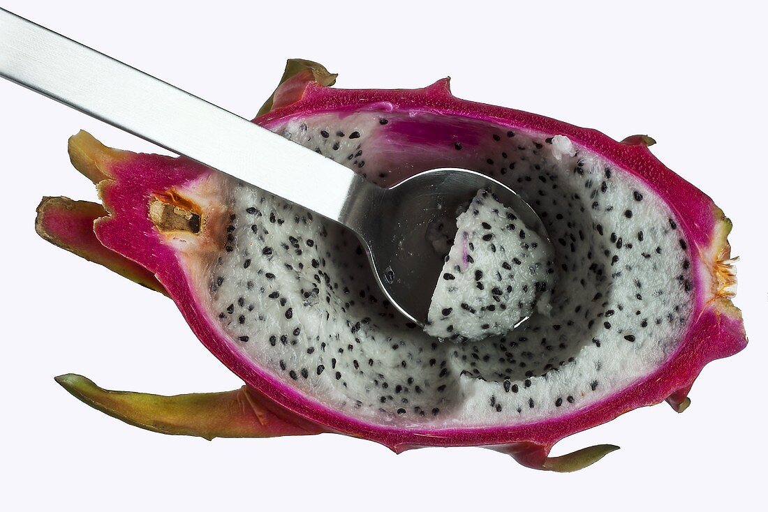 Half a dragonfruit with a spoon