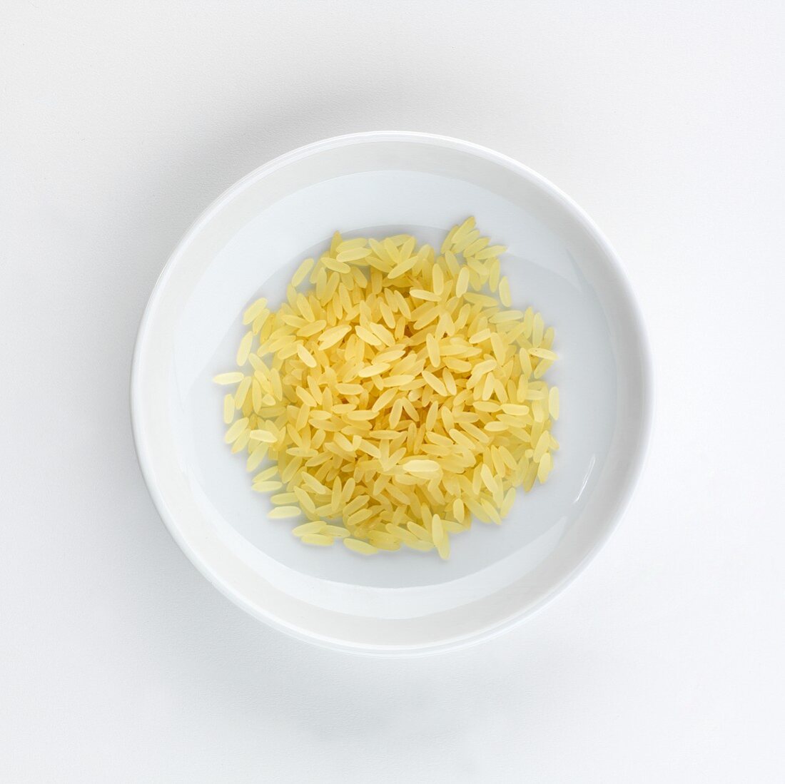 A plate of long grain rice, seen from above