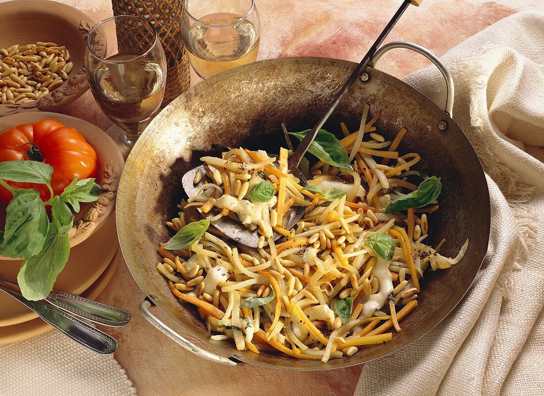 Kohlrabi and Vegetables cooked with Basil and Pine Nuts in a Wok