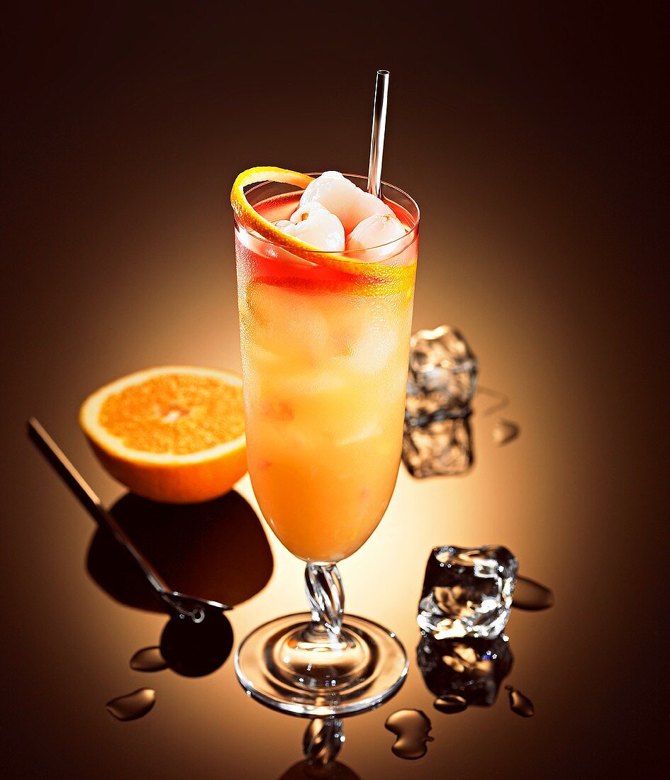 Lychee cocktail with rum, liqueur, orange and grapefruit juice