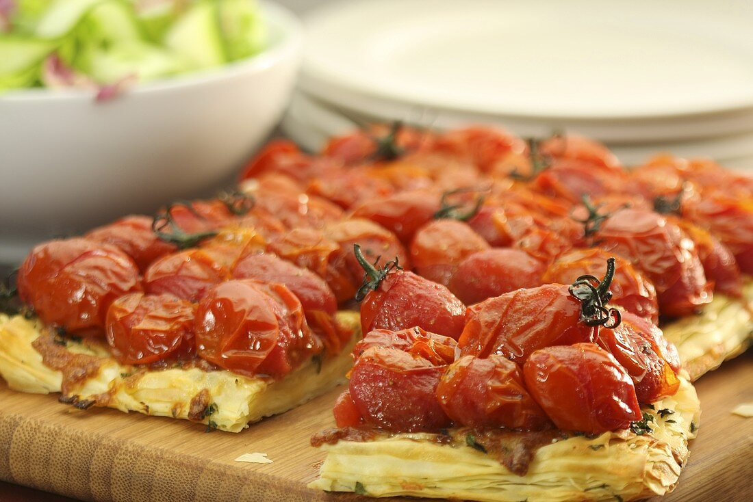 Puff pastry tart with cherry tomatoes and cheese