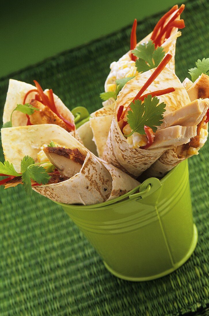Chicken wraps with pepper strips and coriander
