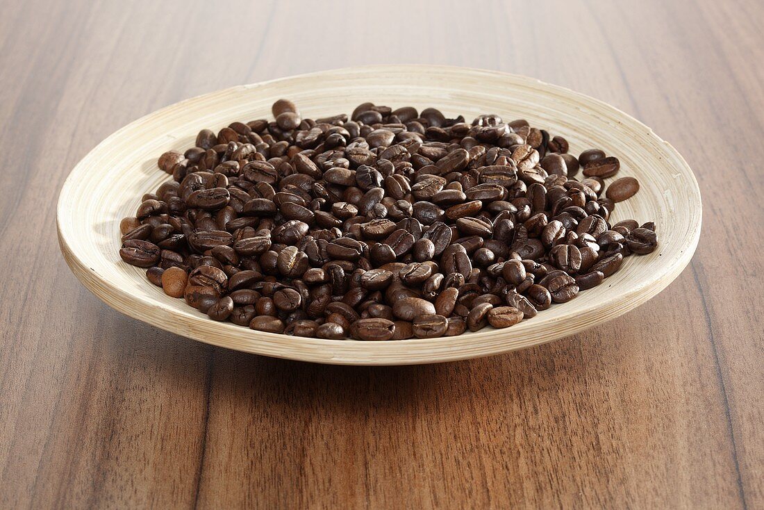 A plate of roasted coffee beans