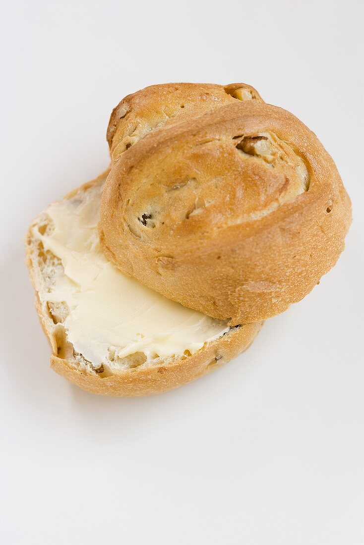 Buttered bread roll with nuts