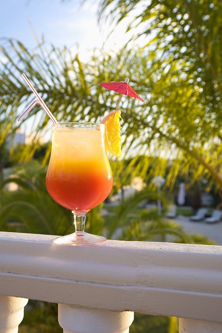 Cocktail on a balcony rail
