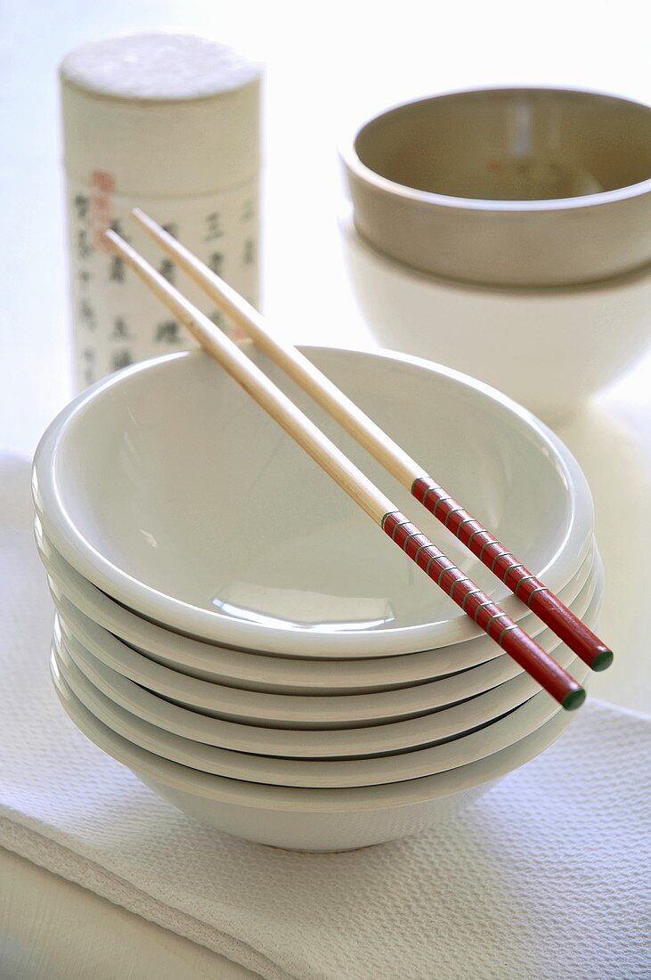 Stack of bowls with chopsticks