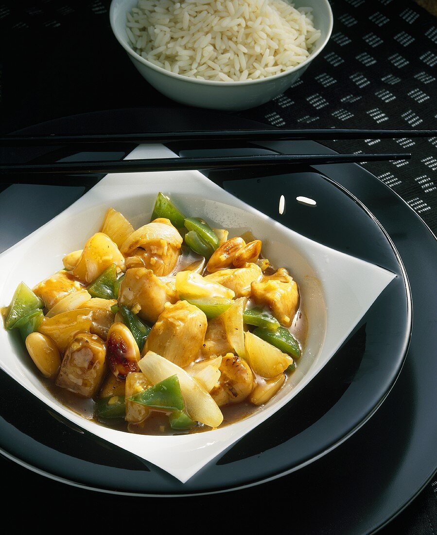 Wok-fried sweet and sour chicken with rice