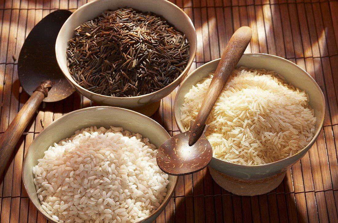 Three different types of rice in bowls