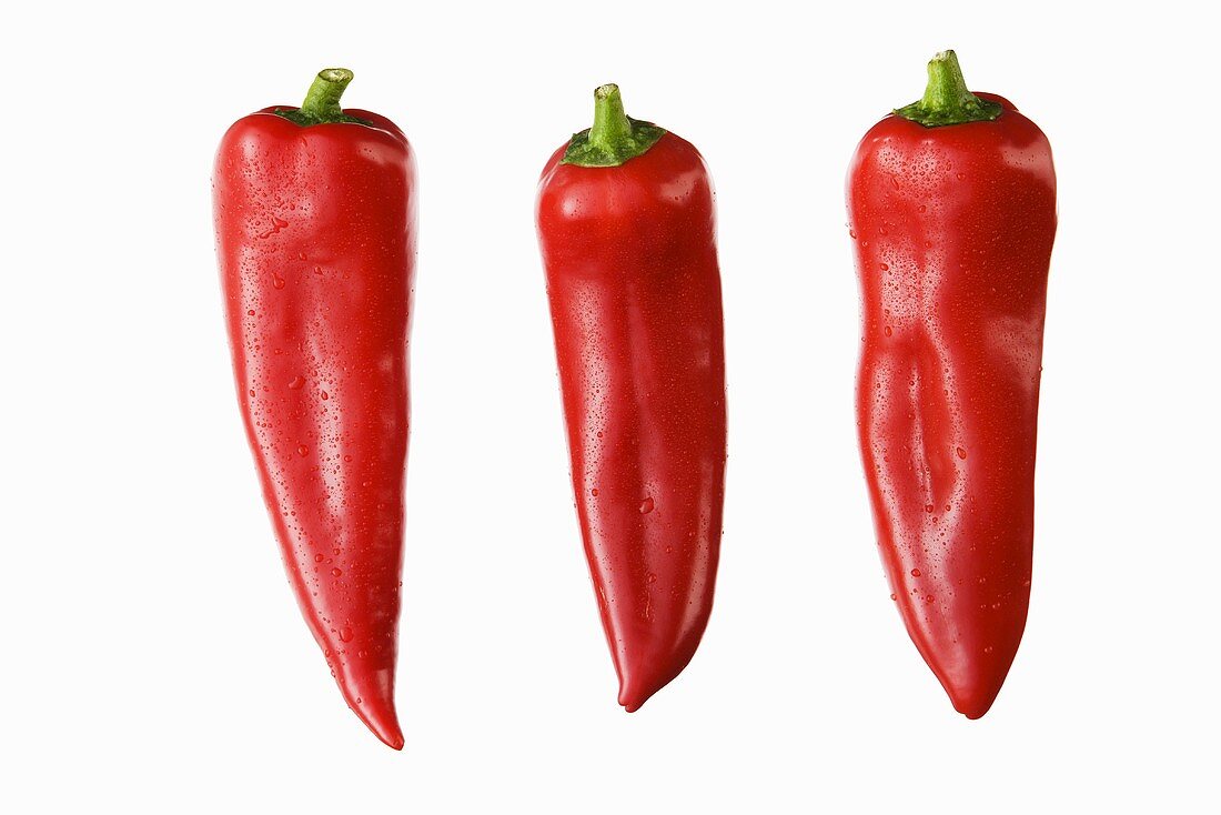 Three red pointed peppers