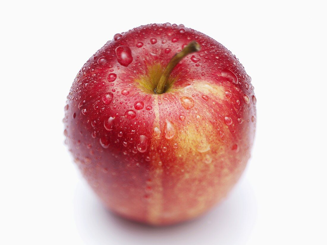 Gala apple with drops of water