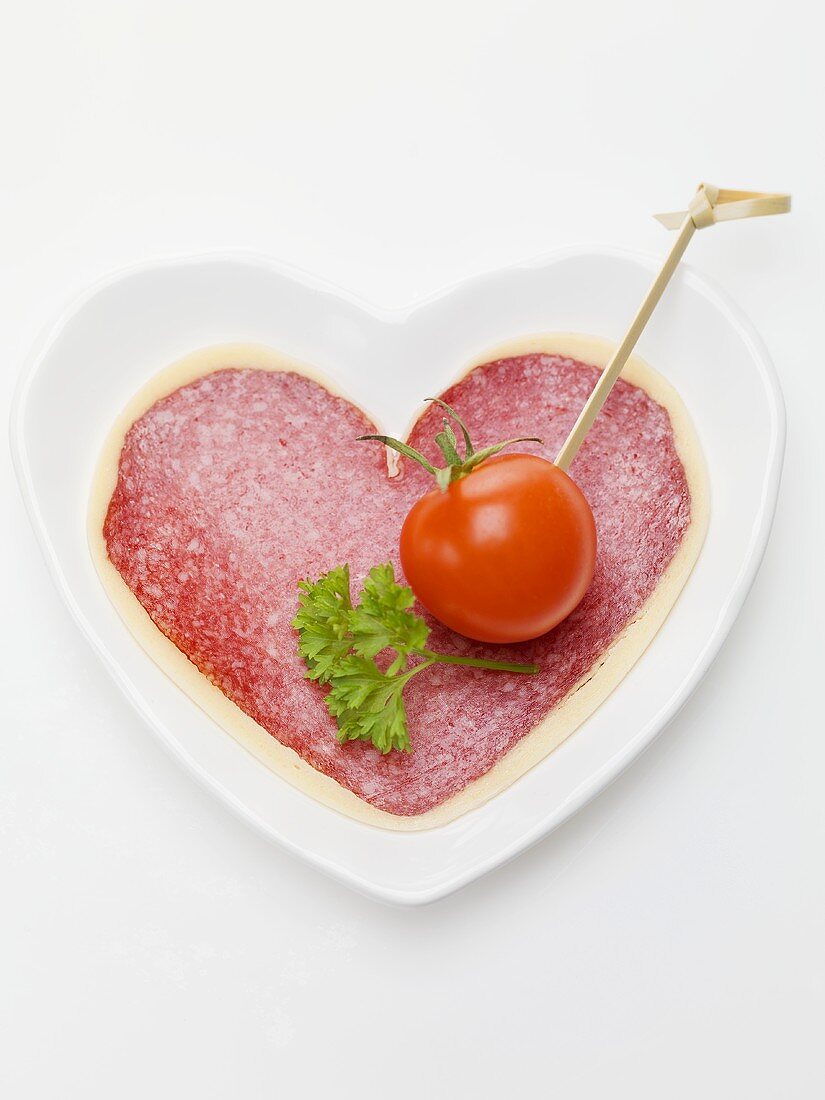 Salami and cheese heart with cherry tomato