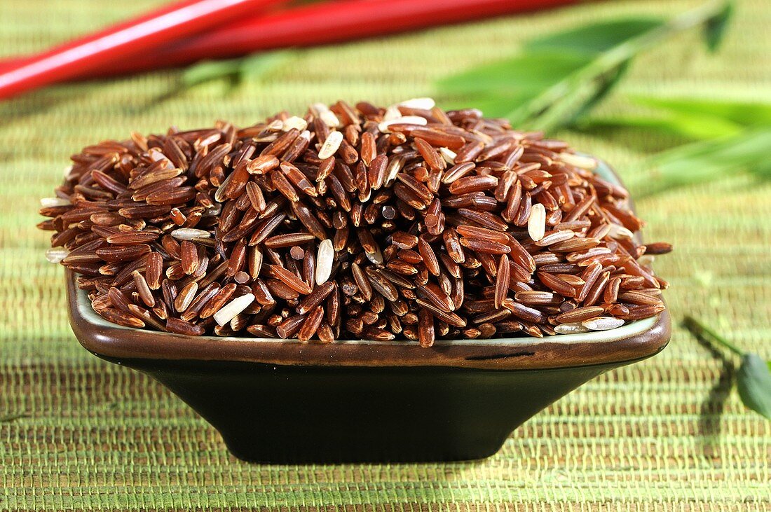 Whole grain red rice in dish