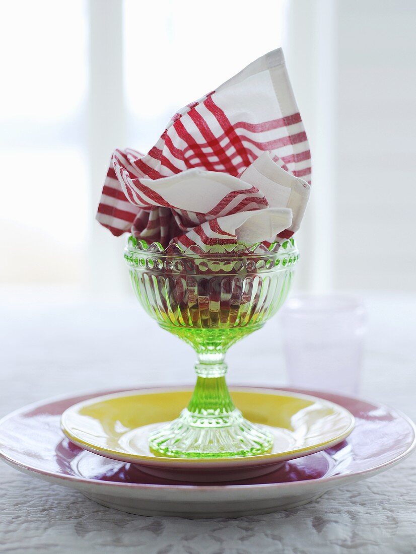 Dessert glass with a serviette and a plate