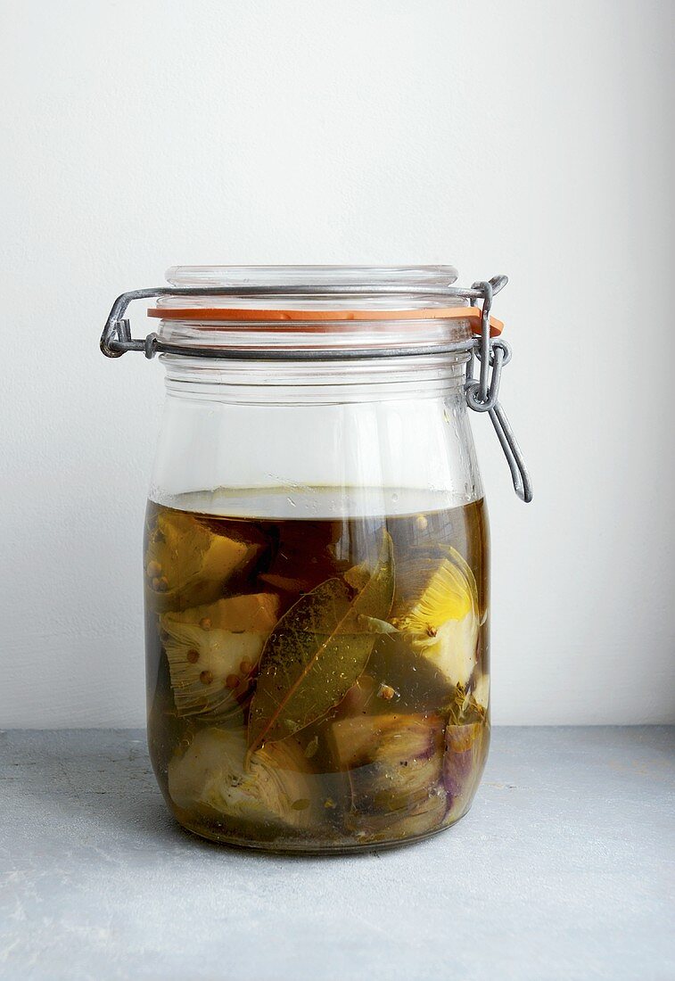 Artichokes in olive oil in a preserving jar