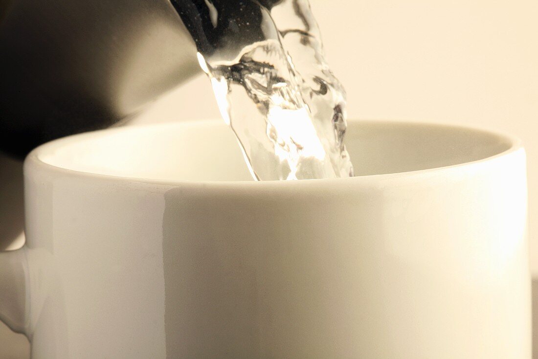 Pouring hot water into a mug