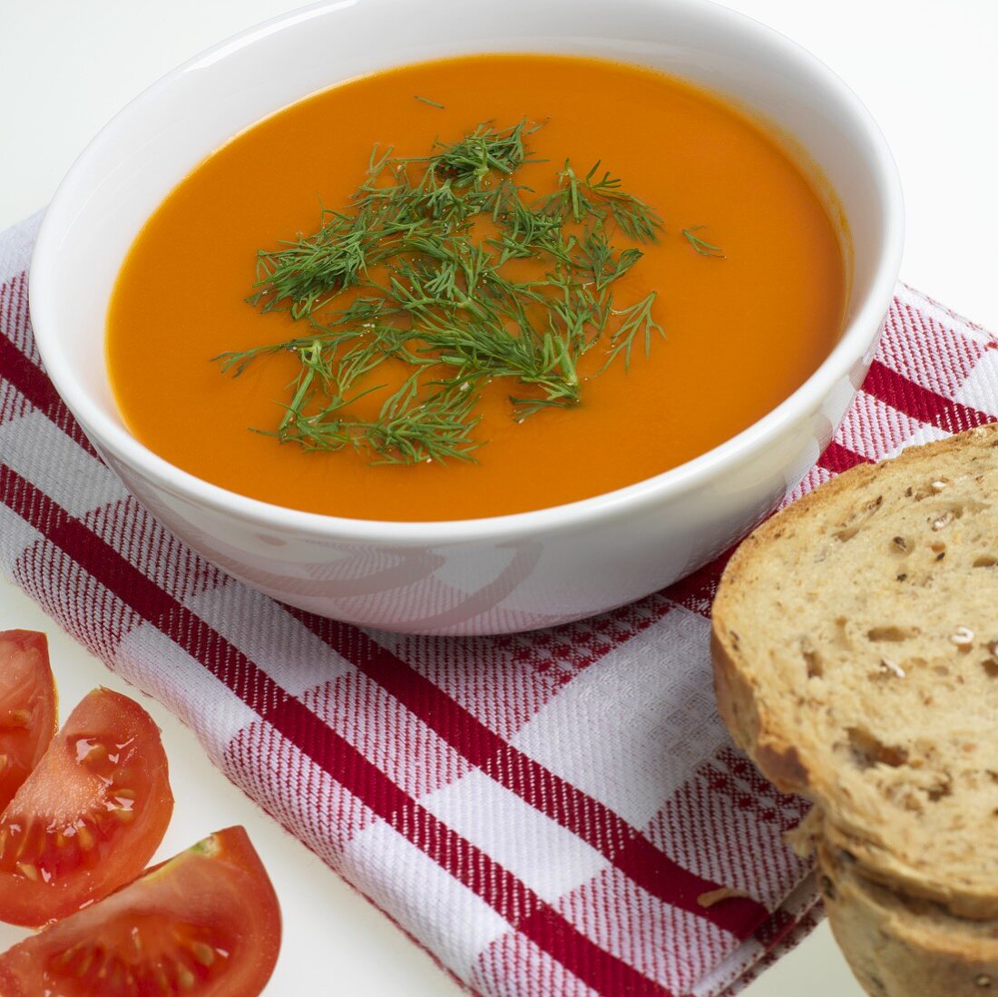 Tomato soup with dill in a soup bowl