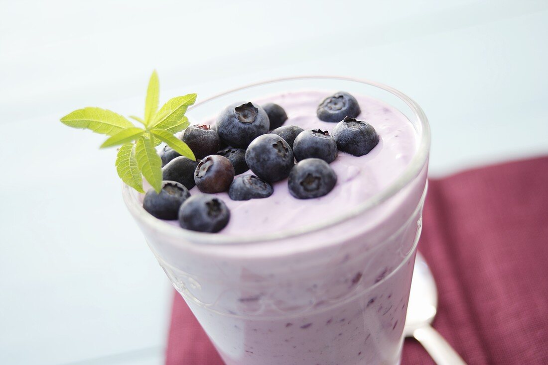 Blueberry quark with fresh berries in a glass