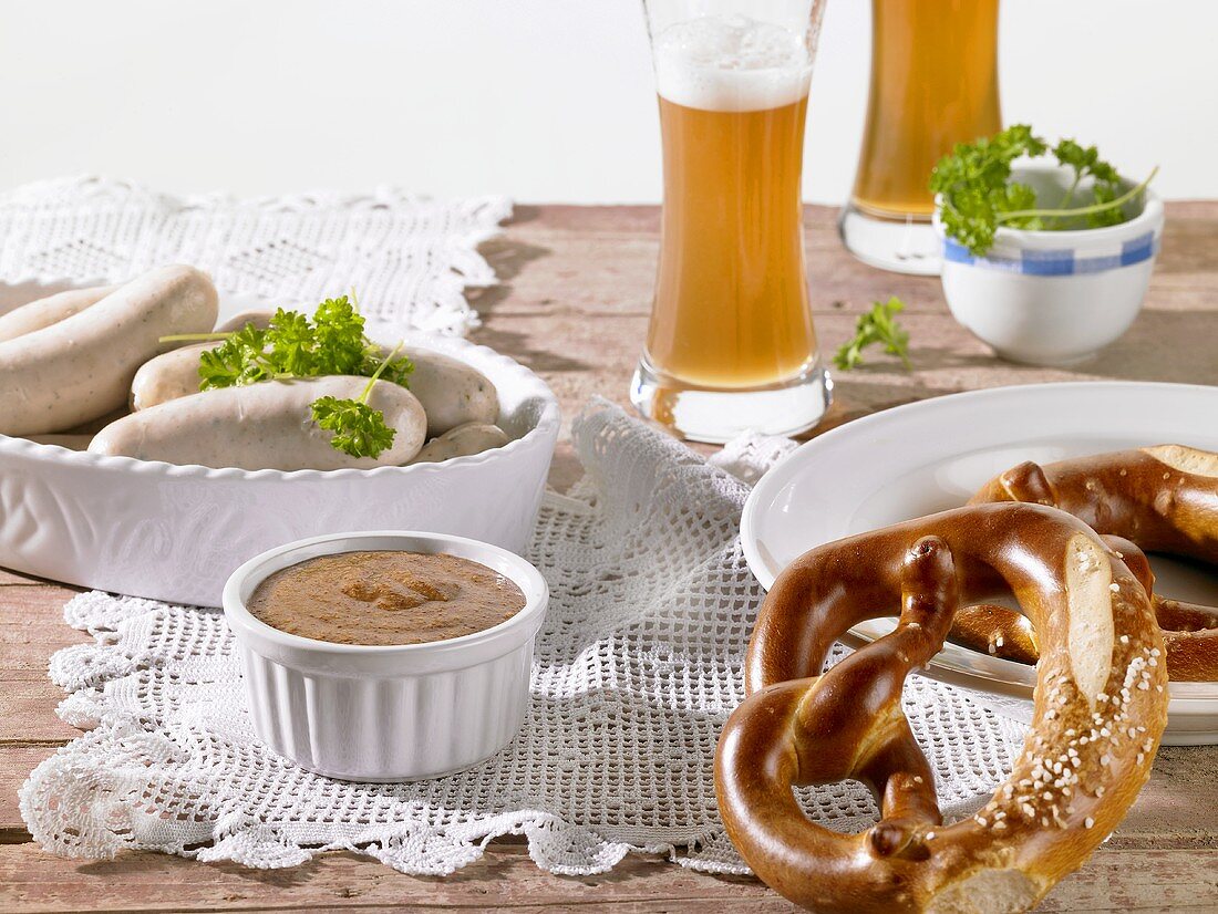 Weisswurst (White sausages) with mustard, pretzels and wheat beer