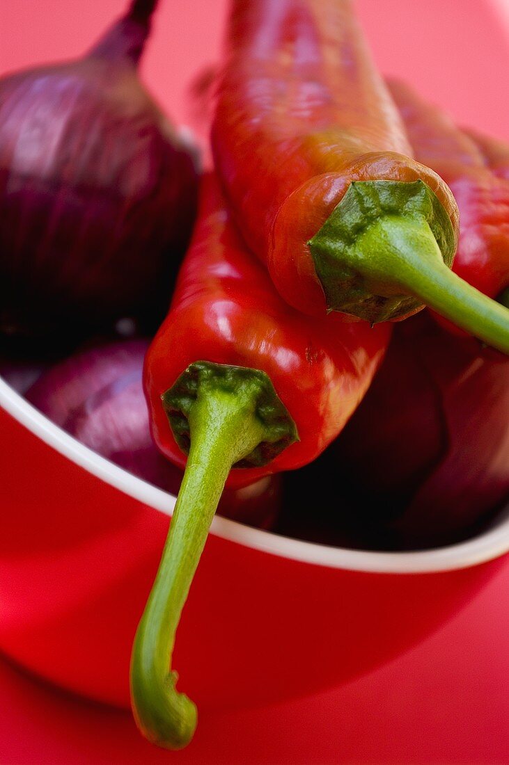 Chillies and red onions in a bowl