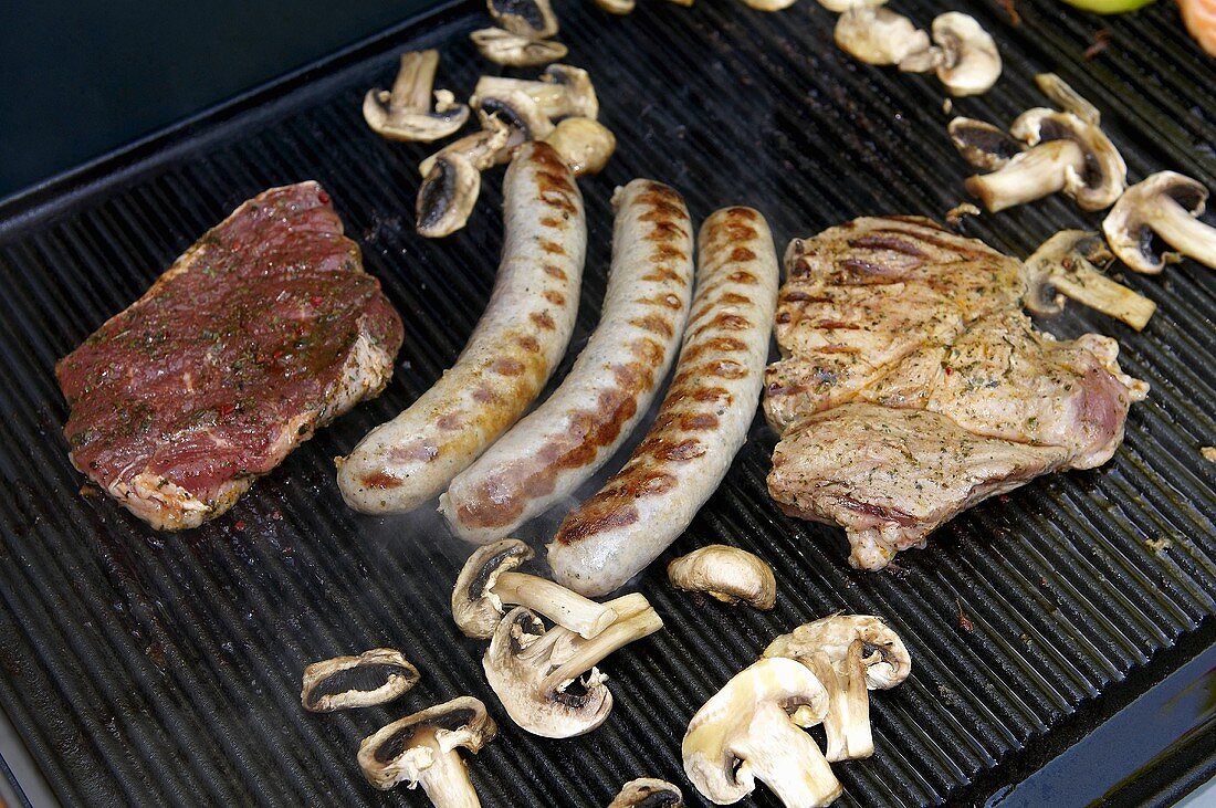 Various foods being barbecued