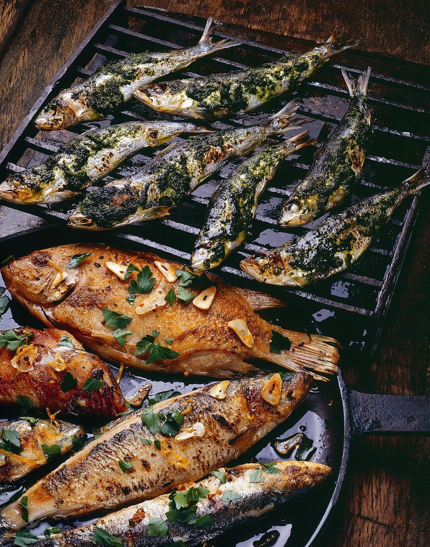 Sardines with salsa verde and various types of fried fish